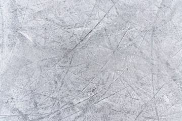 traces on the ice from skates on the rink