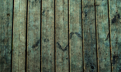 Wooden surface floor as texture grungy scratchy wood close up as retro vintage background toned in blue cold colors