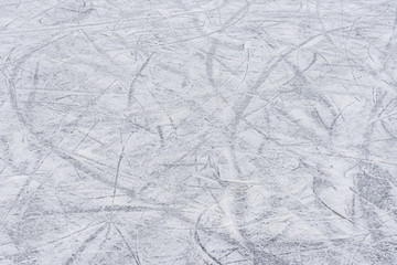 traces on the ice from skates on the rink