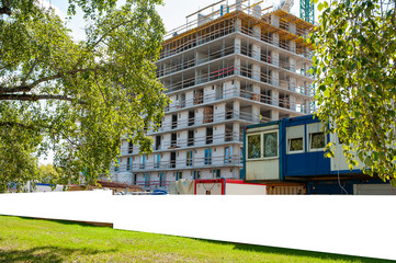 Blank white banner for advertisement on the fence of construction site © diesirae