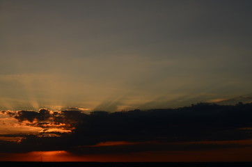 Sunset silhouette of church cross at sunset
