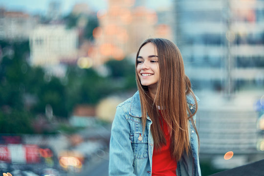 Lovely Teen Girl On Cityscape Background