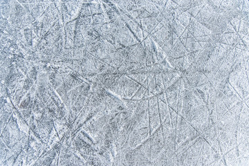 traces on the ice from skates on the rink