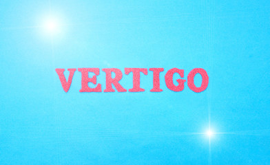 Fototapeta na wymiar Word vertigo in red letters on a blue background. The concept of medical disease of weakness and dizziness, insomnia