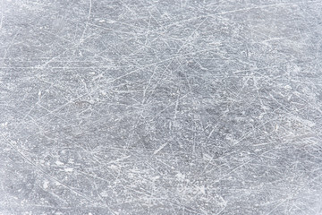 traces on the ice from skates on the rink