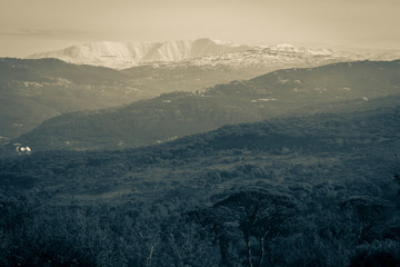 The mountains of Lebanon were once shaded by thick cedar forests and tree is the symbol of country. Beautiful landscape of mountainous town in winter, Eco tourism, Chouf district with large vistas