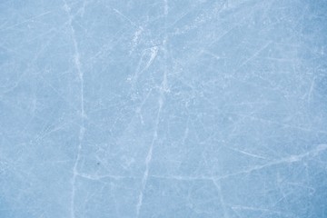 texture of ice on the rink with skating traces 