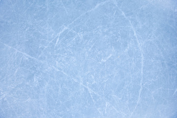 texture of ice on the rink with skating traces 