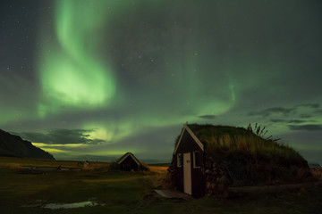 Northern lights over GRETTISLAUG Campsite on Iceland