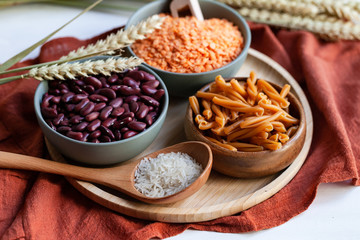 Vegan protein source. Beans, lentils, chickpea pasta. Healthy and tasty vegetarian food, ingredients ready for cooking. Front view, close up.