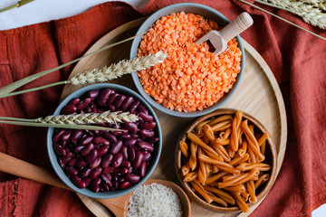 Beans, lentils, chickpea pasta. Healthy and tasty vegetarian food, ingredients ready for cooking. Vegan protein source. Flat lay, top view, close up.