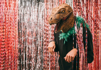 Side view male in dinosaur costume