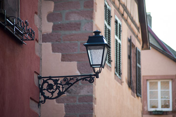 Closeup of vintage street lamp on medieval architecture background