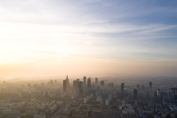 Aerial view of skyscrapers in the center of the Warsaw at sunrise.