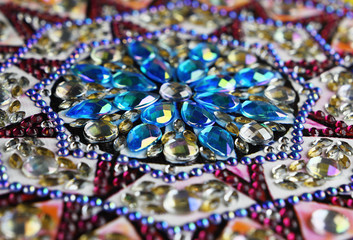Fototapeta na wymiar Closeup of abstract colorful rhinestones mosaic
