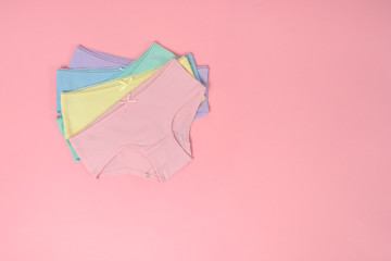 multi-colored cotton panties for a girl on a pink background