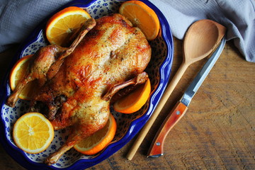Whole crispy golden roast duck with marinated with fresh orange slices for a festive . Top view...