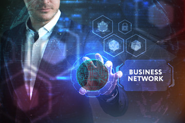 Business, Technology, Internet and network concept. Young businessman working on a virtual screen of the future and sees the inscription: Business network