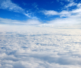 Naklejka premium White clouds. View from the window of an airplane