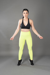 Beautiful fitness body builder woman in Studio