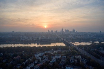 Aerial view of skyscrapers in the center of the Warsaw at sunrise.