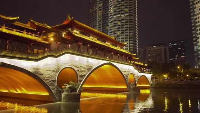 Moving shot of Anshun Bridge and modern buildings in Chengdu