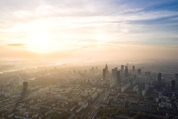 Aerial view of skyscrapers in the center of the Warsaw at sunrise.