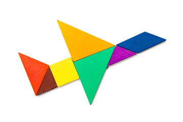 Color wood tangram puzzle in airplane shape on white background
