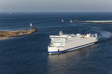 PASSENGER FERRY - The white ship flows through port channel to terminal