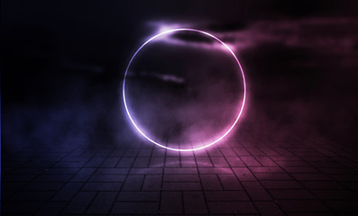 Background of empty stage show. Neon blue and purple light and laser show. Laser futuristic shapes on a dark background. Abstract dark background with neon glow