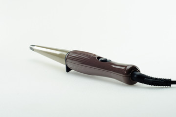 Hair iron on white background with copy space