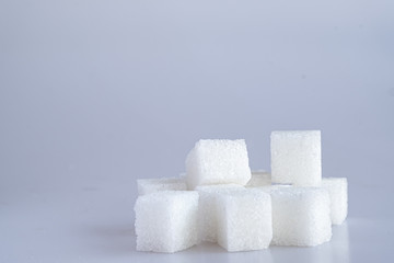 White sugar cube on white background.