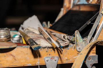 Artistic process of drawing with paints and brush. Brush for painting, rags, easel.