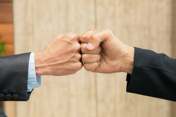 Businessman partnership is suit fist bump business deal negotiation successful,  Asian business man...