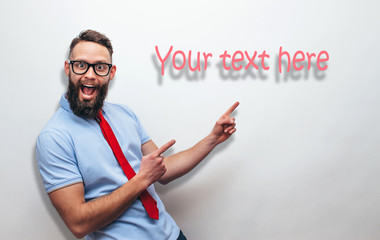 Handsome hipster man pointing with fingers at your text. Crazy hipster guy emotions. Discount, sale, season sales.