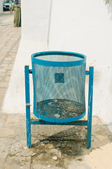 Symbol of the waste problem. Garbage can on the street of the resort of the blue and white city of Sidi Bou Said