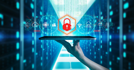 Malware and cyber crime by an anonymous hacker concept.Businessman holding antivirus icon on blurred server background using protection network security computer to block a cyber attack and Malware.