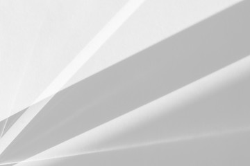 Overlay effect for photo and mockups. Organic drop diagonal shadow and rays of light from window on a white wall.
