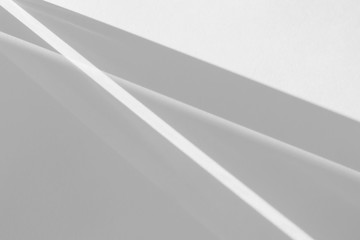 Overlay effect for photo and mockups. Organic drop diagonal shadow and rays of light from window on a white wall.