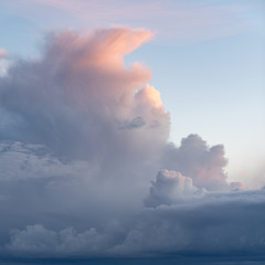 Beautiful sunset clouds, dark with bright pink tips.