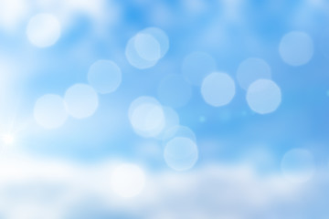 Abstract background of blue sky with bokeh and sunlight