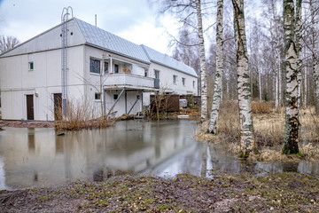 Fototapeta na wymiar Flood. Water near the house. Finland, February 2020