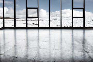 A platform of snow covered by a sheer mountain range