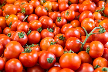ripe red tomatoes on the counter in the store