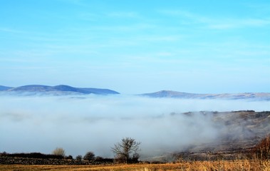 landscape with fog in the valley
