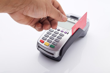 Credit card and pos terminal on white