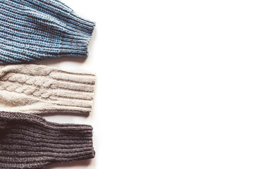 Warm knitted sleeve from a sweater with a pattern. Isolate on white.