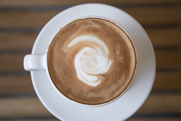 Top viwe white coffee cup on table.