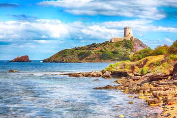 Ancient Spanish tower of Coltellazzo of Saint Efisio lighthouse at Nora archeological site