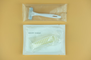 Razor, mini wash towel and comb in package. Travel set